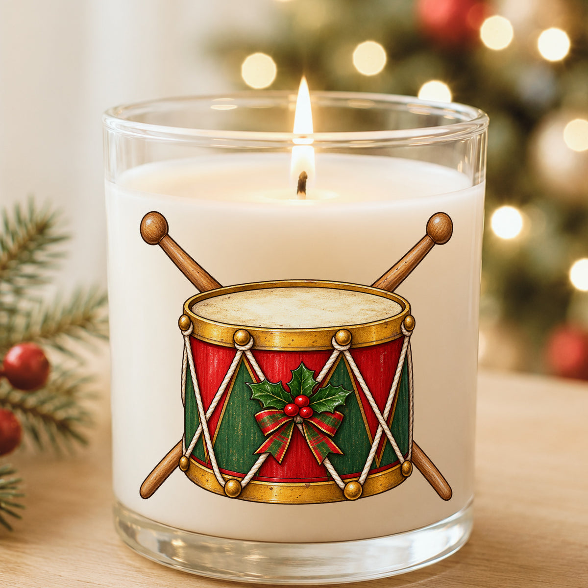Vintage Toy Drum With Drumsticks UV DTF sticker applied to a white candle in a glass holder near Christmas lights