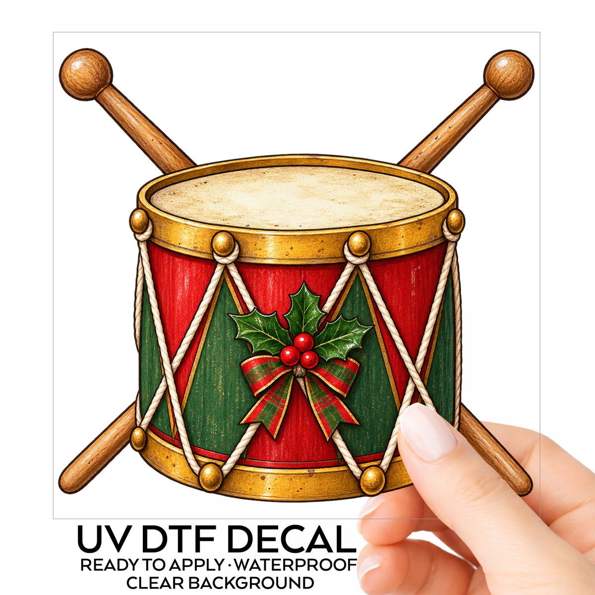 Vintage Toy Drum With Drumsticks UV DTF sticker on its backing card, held in hand