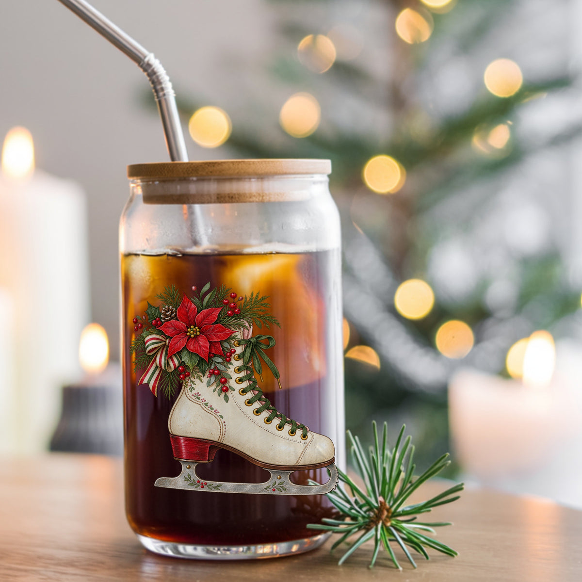 Vintage Ice Skate With Poinsettia UV DTF sticker applied to a glass can cup of iced coffee with a straw