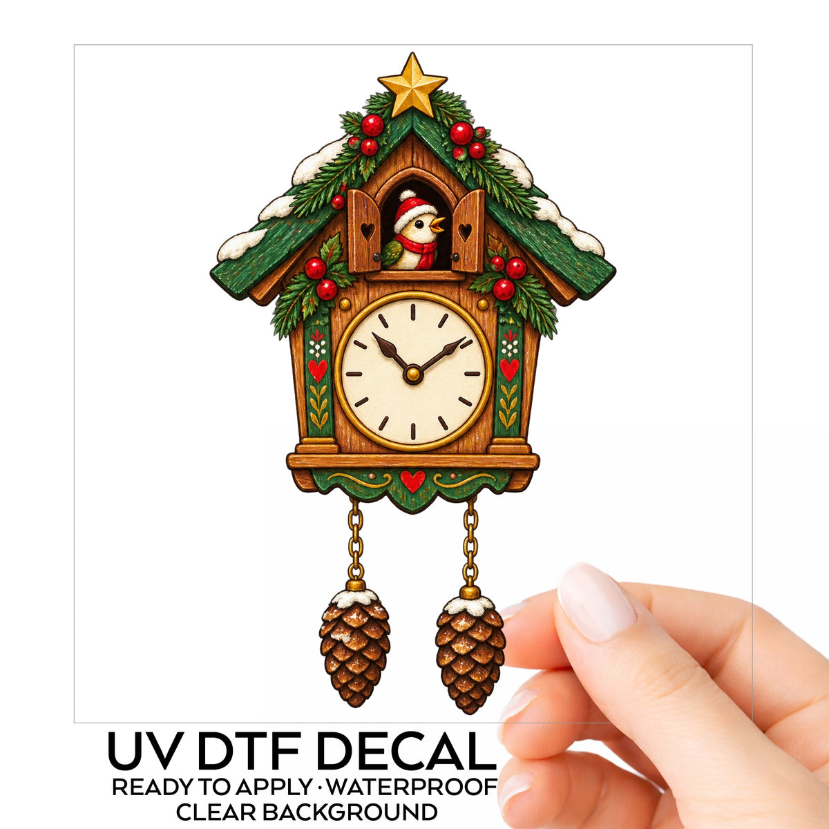 Christmas Cuckoo Clock UV DTF sticker on its backing card, held in hand