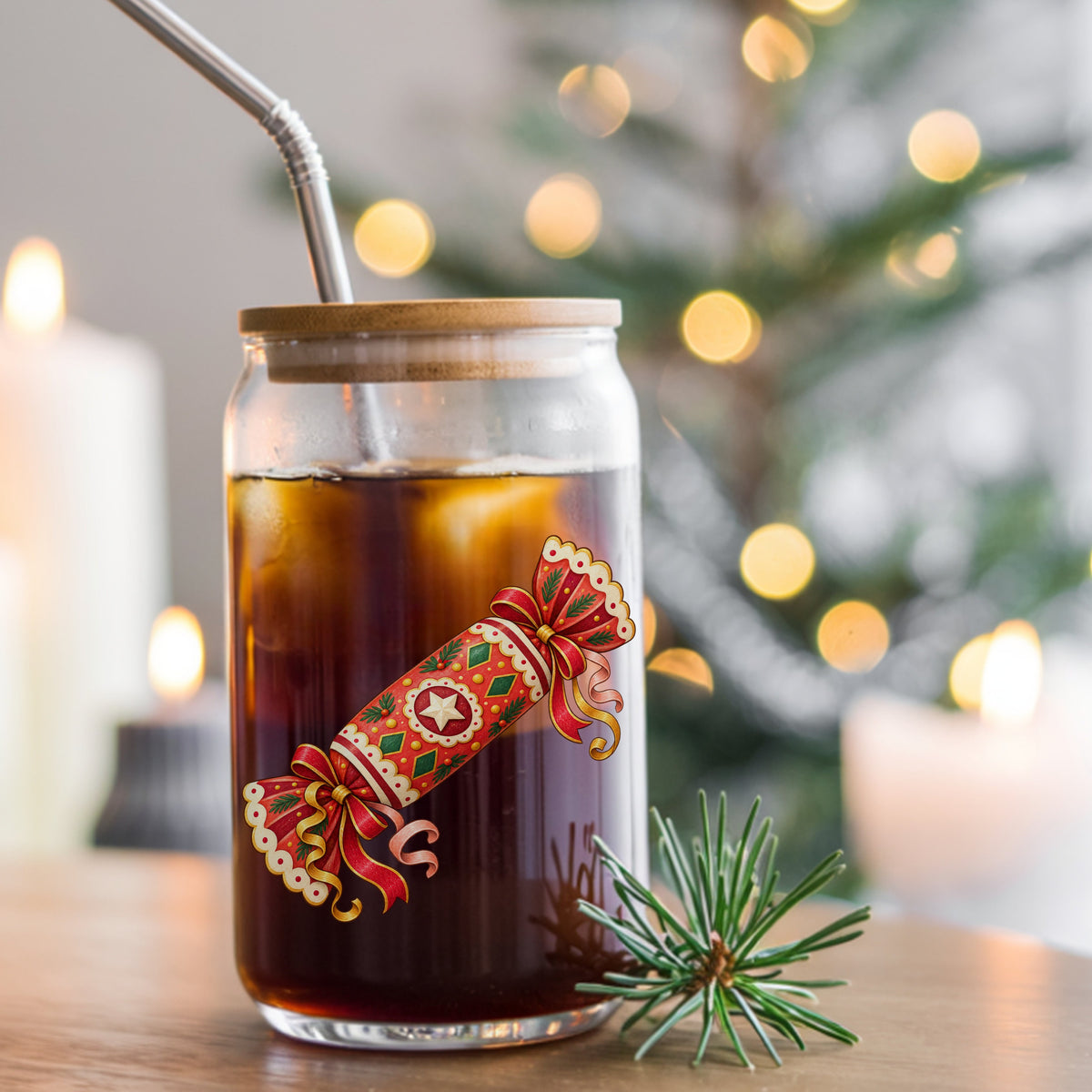Christmas Cracker With Ribbon Bows UV DTF sticker applied to a glass can cup of iced coffee with a straw