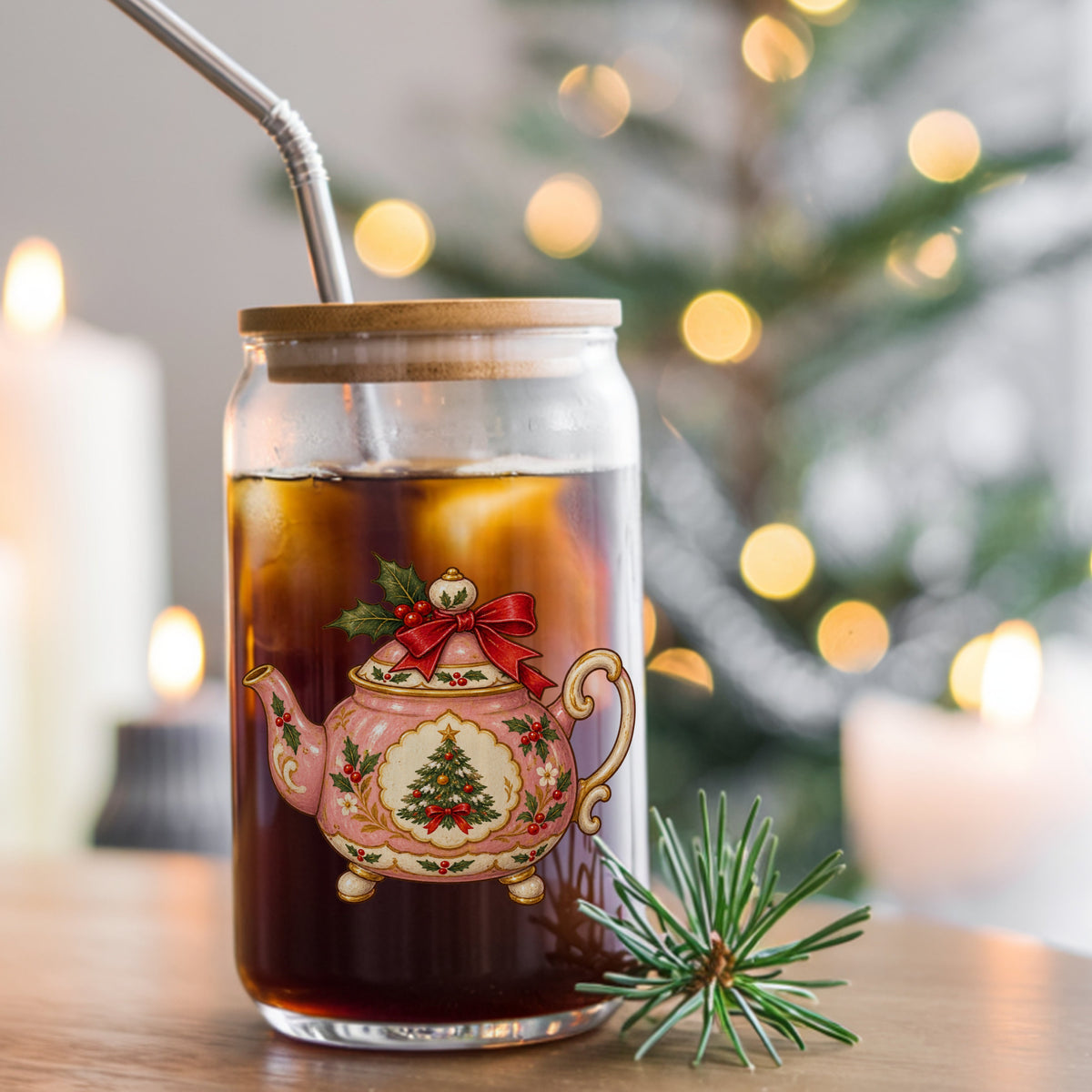 Pink Christmas Teapot With Holly UV DTF sticker applied to a glass can cup of iced coffee with a straw