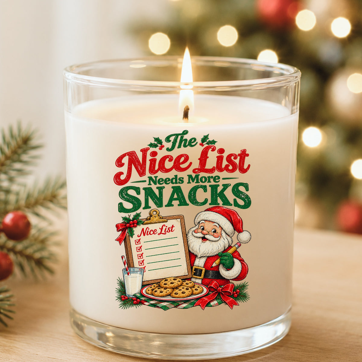 Nice List Needs More Snacks Santa UV DTF sticker applied to a white candle in a glass holder near Christmas lights