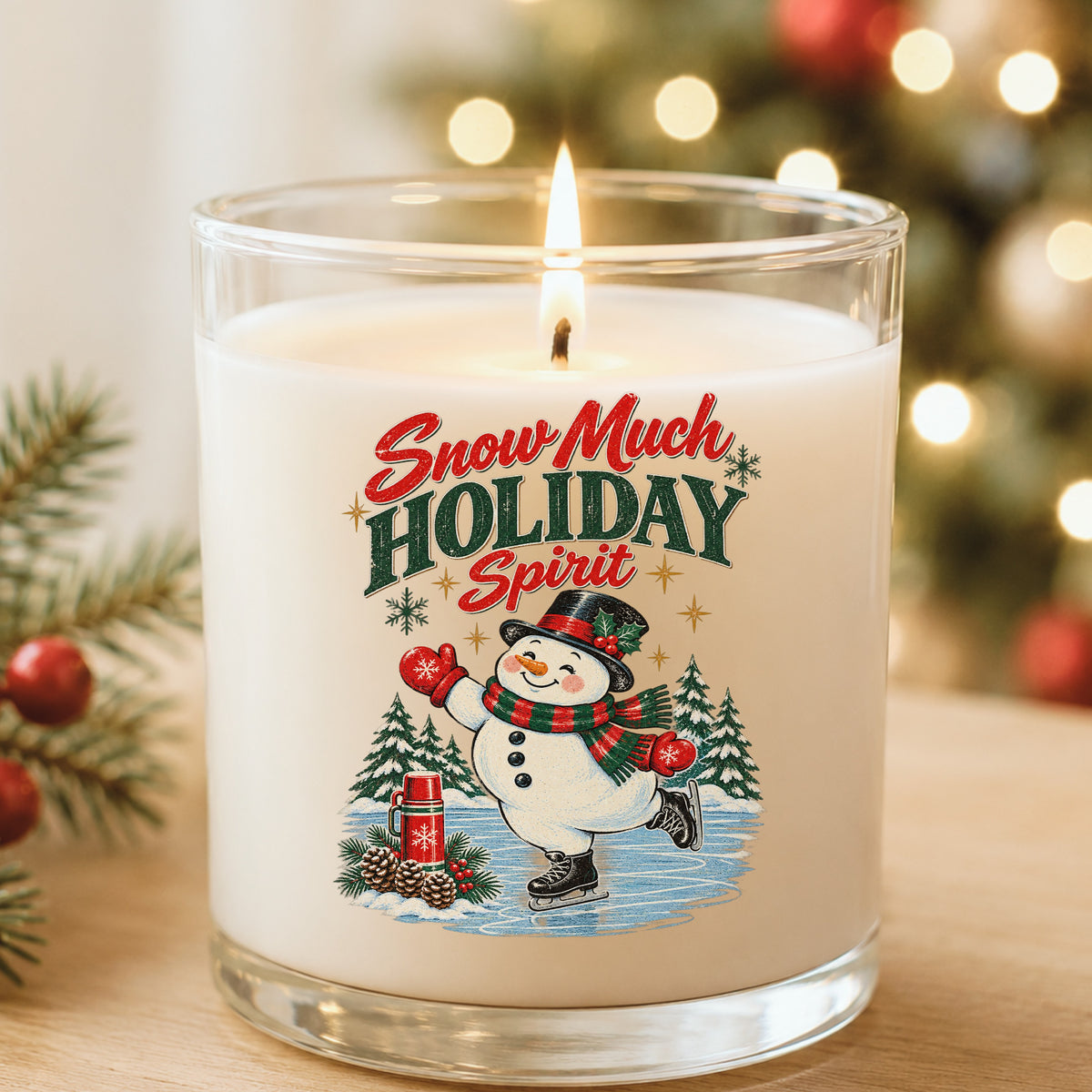 Snow Much Holiday Spirit Snowman UV DTF sticker applied to a white candle in a glass holder near Christmas lights