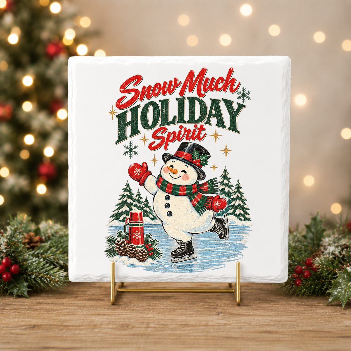 Snow Much Holiday Spirit Snowman UV DTF sticker applied to a white tile on a gold stand