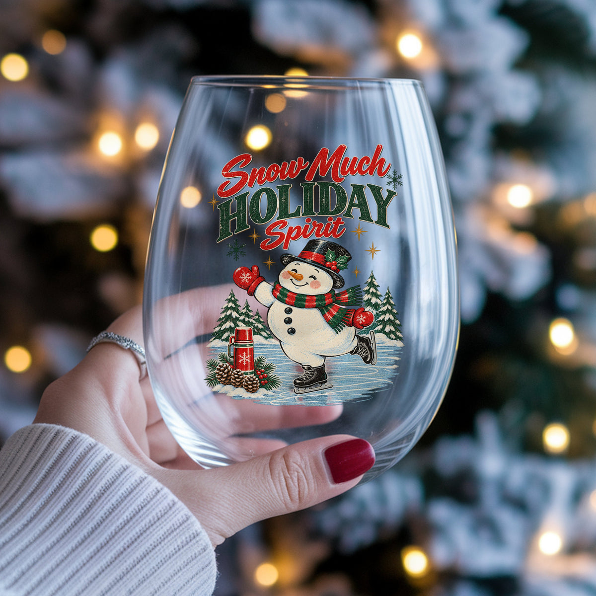 Snow Much Holiday Spirit Snowman UV DTF sticker applied to a stemless wine glass held in hand