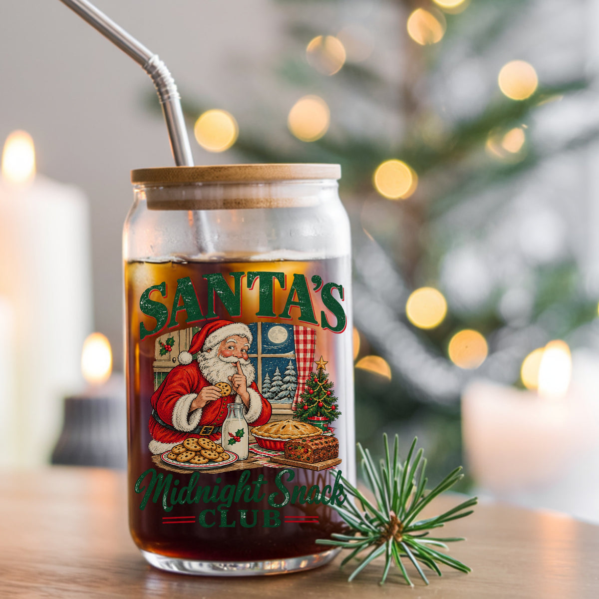 Santa's Midnight Snack Club UV DTF sticker applied to a glass can cup of iced coffee with a straw
