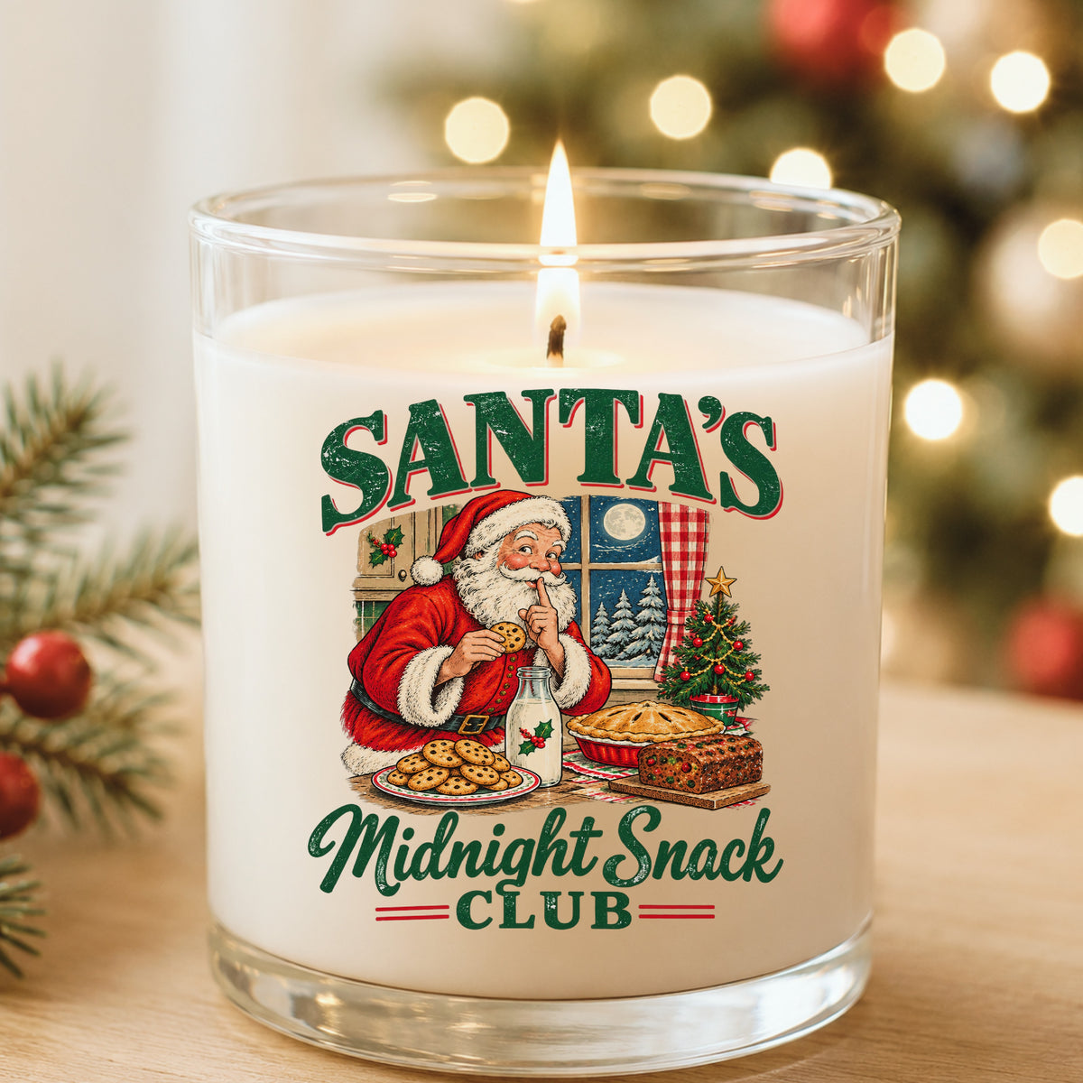 Santa's Midnight Snack Club UV DTF sticker applied to a white candle in a glass holder near Christmas lights