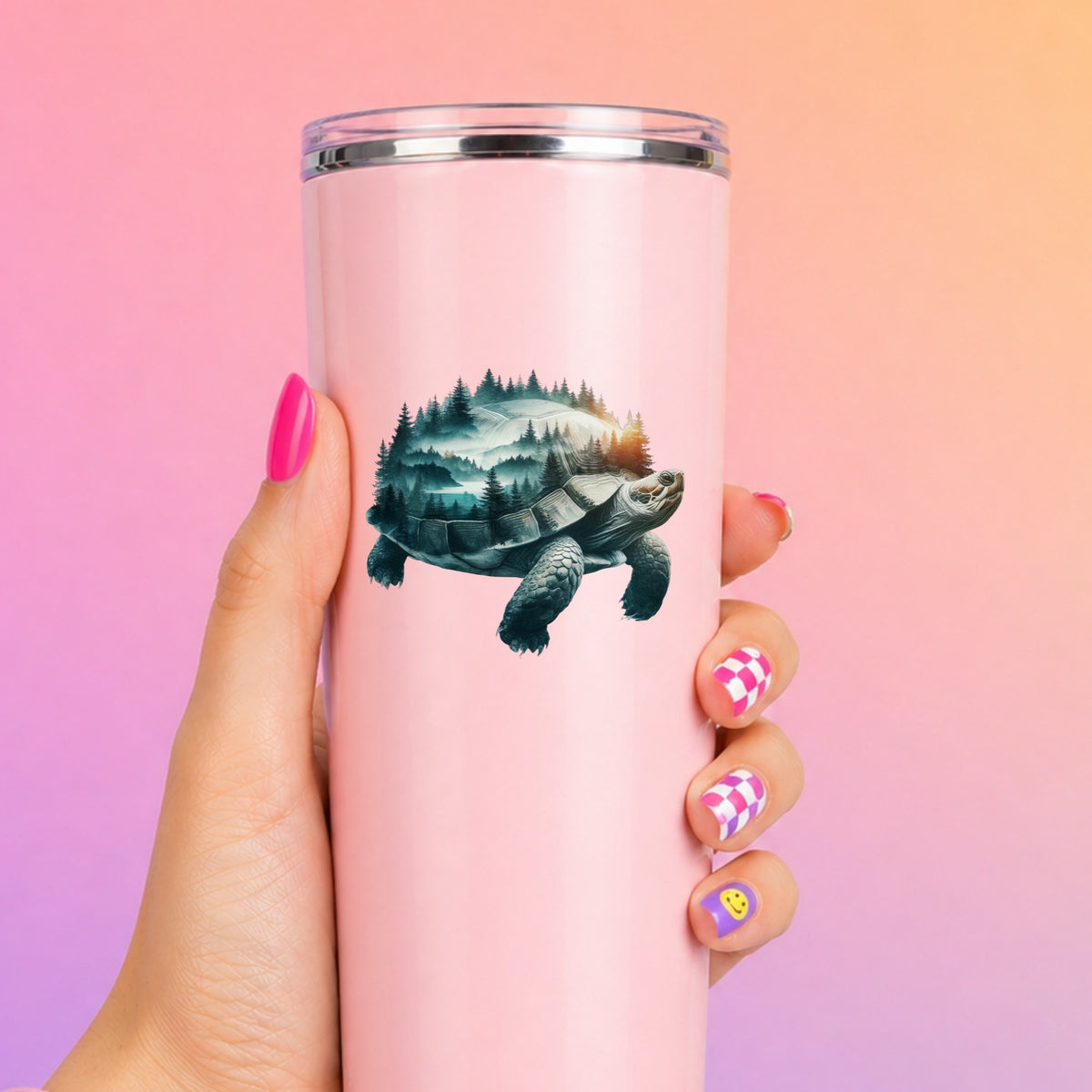 Forest Tortoise UV DTF sticker applied to a tall pink tumbler on a pink and orange background