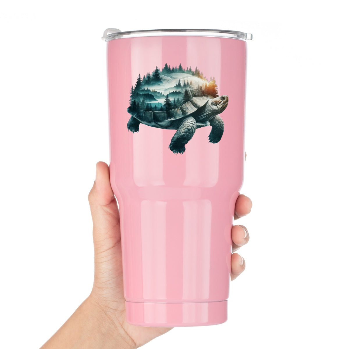 Forest Tortoise UV DTF sticker applied to a pink tumbler held against a white background