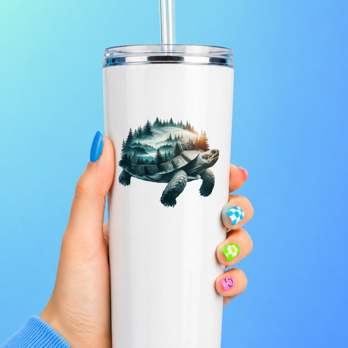 Forest Tortoise UV DTF sticker applied to a white straw tumbler on a blue background