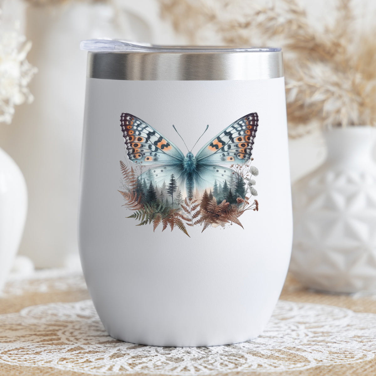 Fern Butterfly UV DTF sticker applied to a white stemless tumbler with a lid