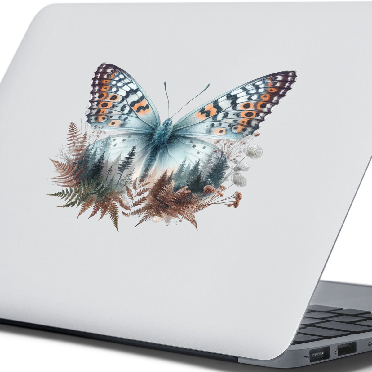 Fern Butterfly UV DTF sticker applied to the lid of a silver laptop