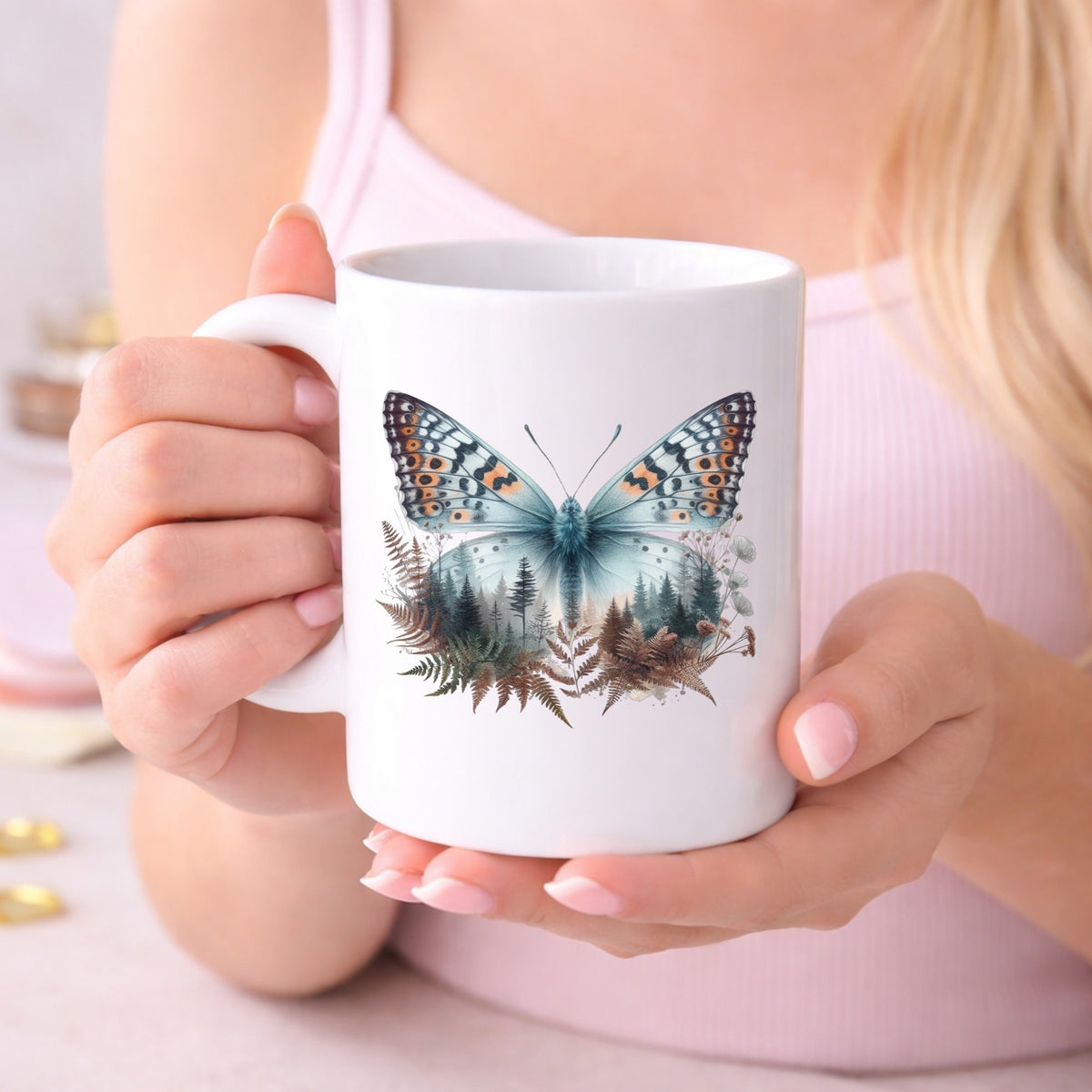 Fern Butterfly UV DTF sticker applied to a white coffee mug held in both hands