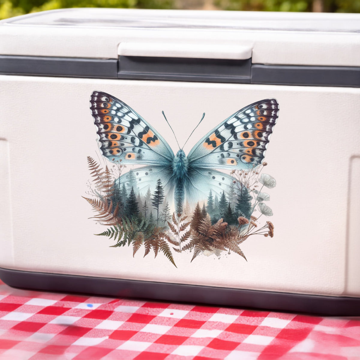 Fern Butterfly UV DTF sticker applied to a white cooler on a red gingham cloth