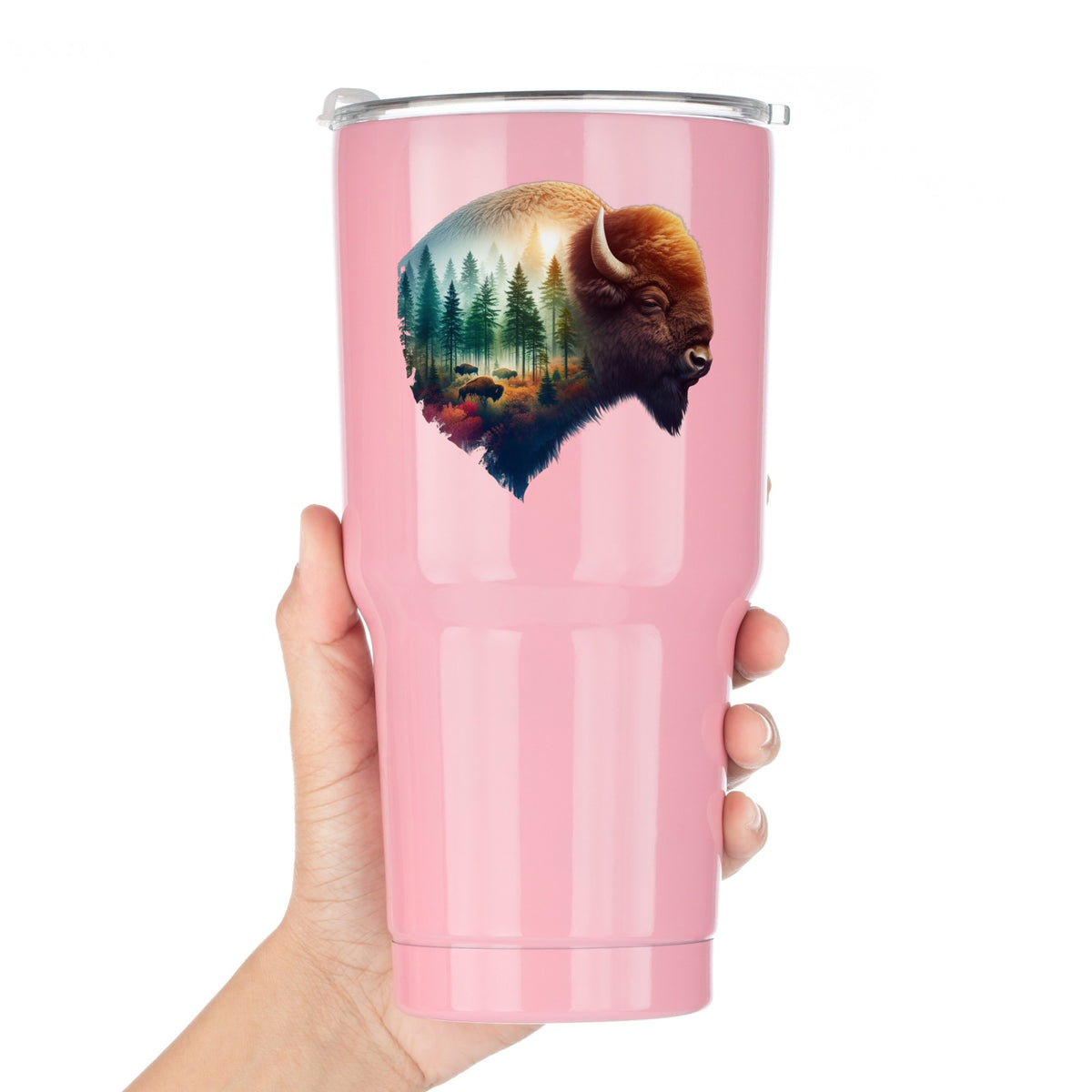 Sunrise Bison UV DTF sticker applied to a pink tumbler held against a white background