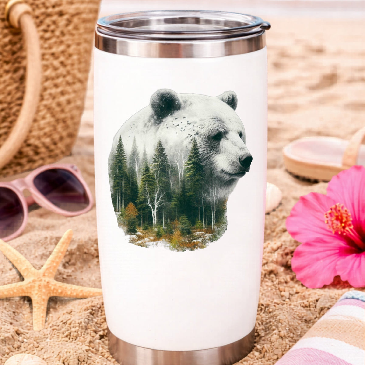White Bear UV DTF sticker applied to a white travel tumbler on beach sand