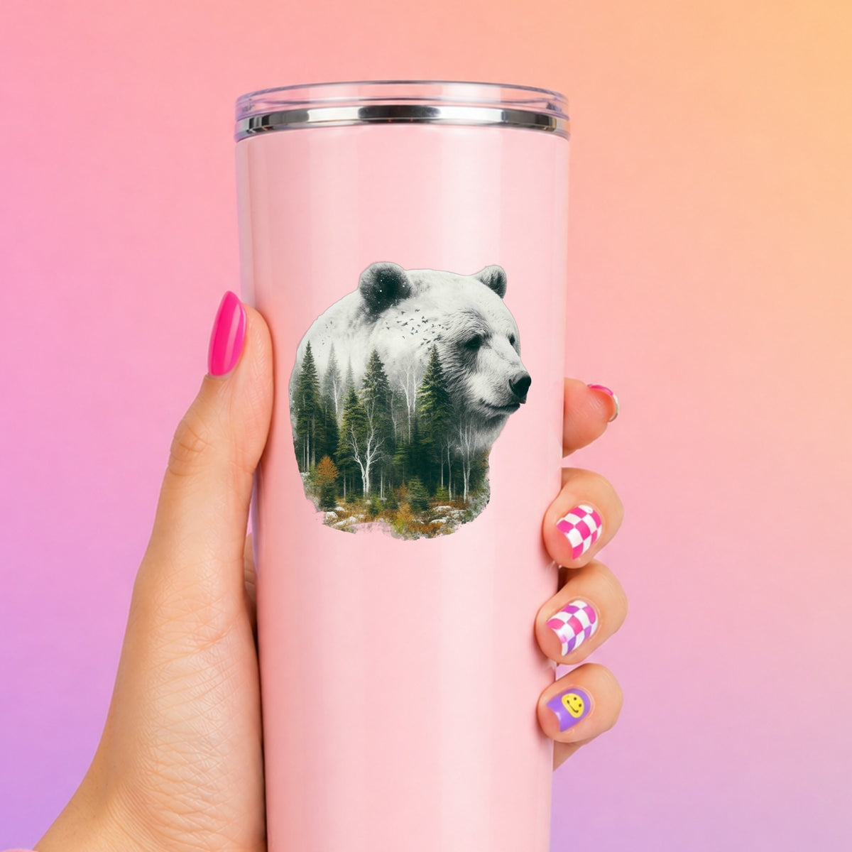 White Bear UV DTF sticker applied to a tall pink tumbler on a pink and orange background