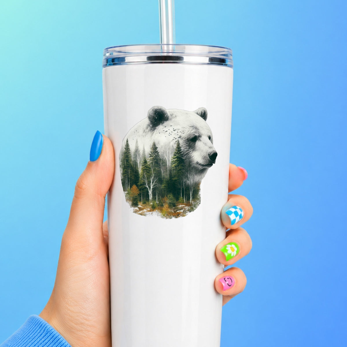 White Bear UV DTF sticker applied to a white straw tumbler on a blue background