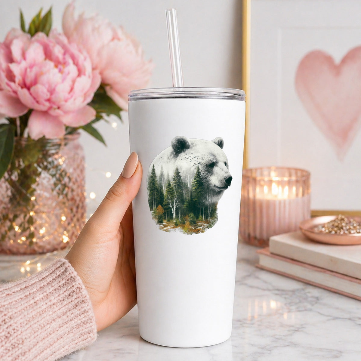 White Bear UV DTF sticker applied to a white straw tumbler beside pink peonies