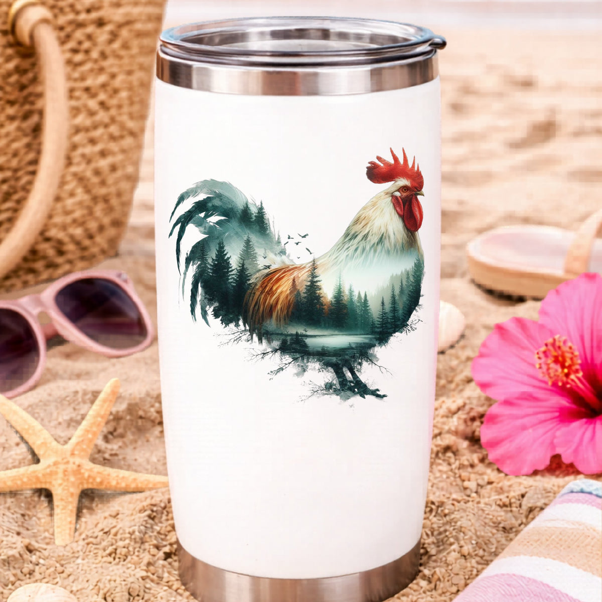 Forest Lake Rooster UV DTF sticker applied to a white travel tumbler on beach sand