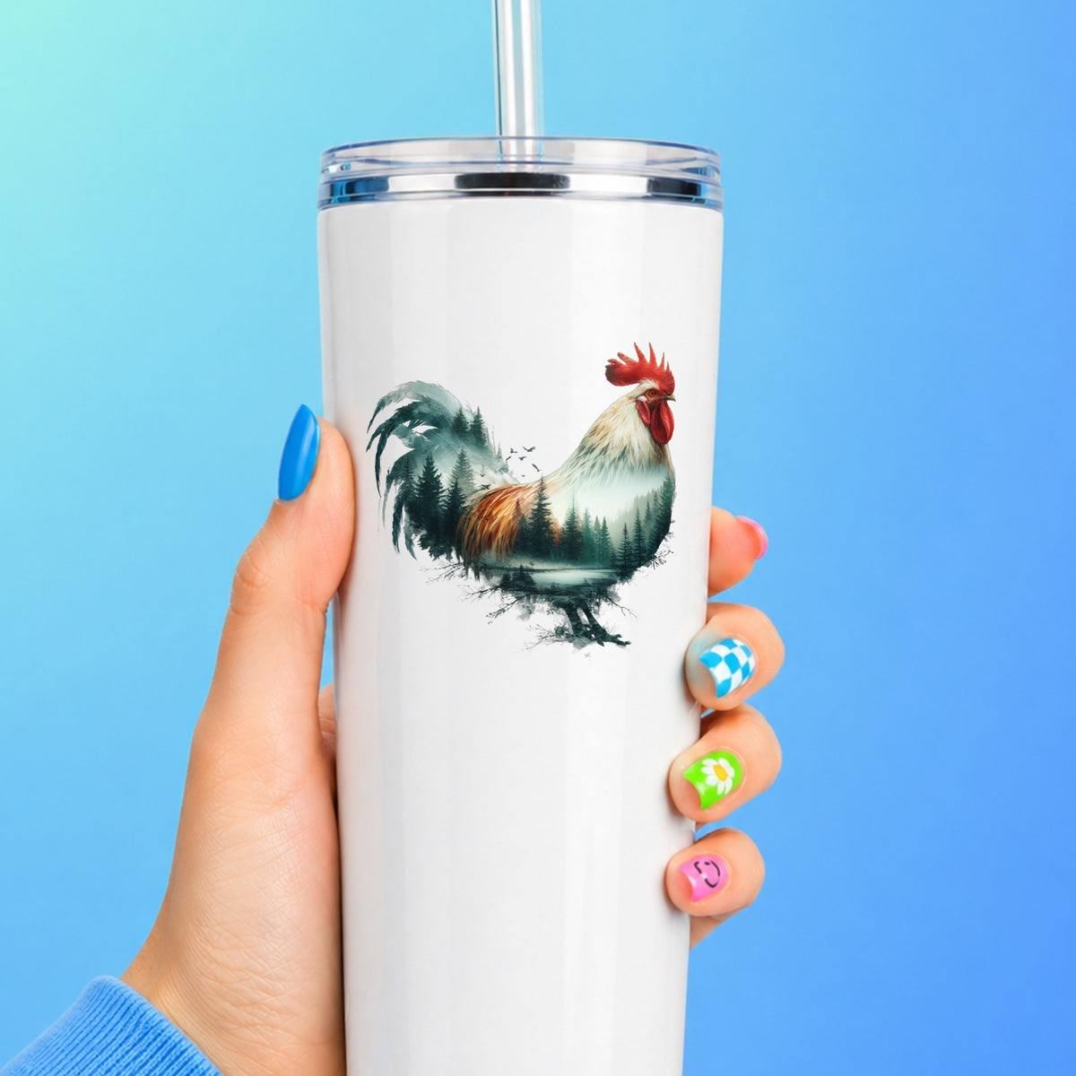 Forest Lake Rooster UV DTF sticker applied to a white straw tumbler on a blue background