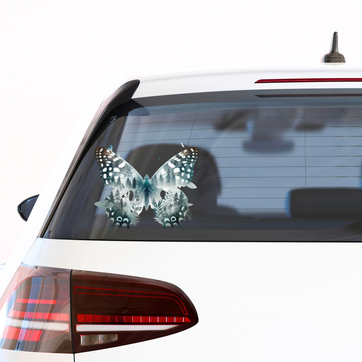 Black White Butterfly UV DTF sticker applied to the rear window of a white car