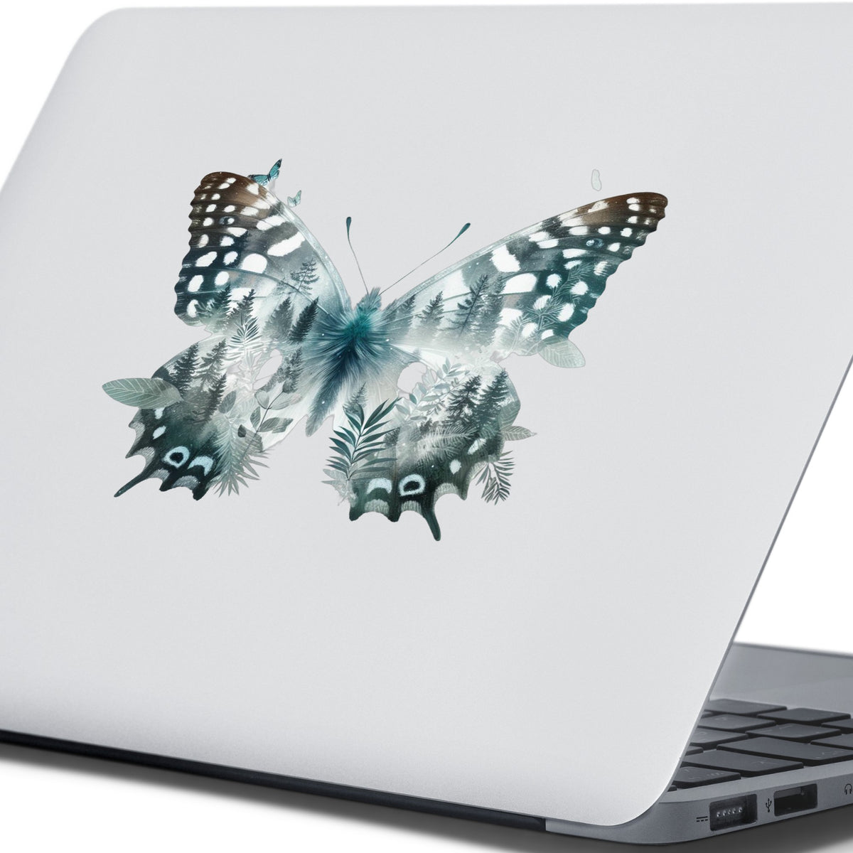 Black White Butterfly UV DTF sticker applied to the lid of a silver laptop