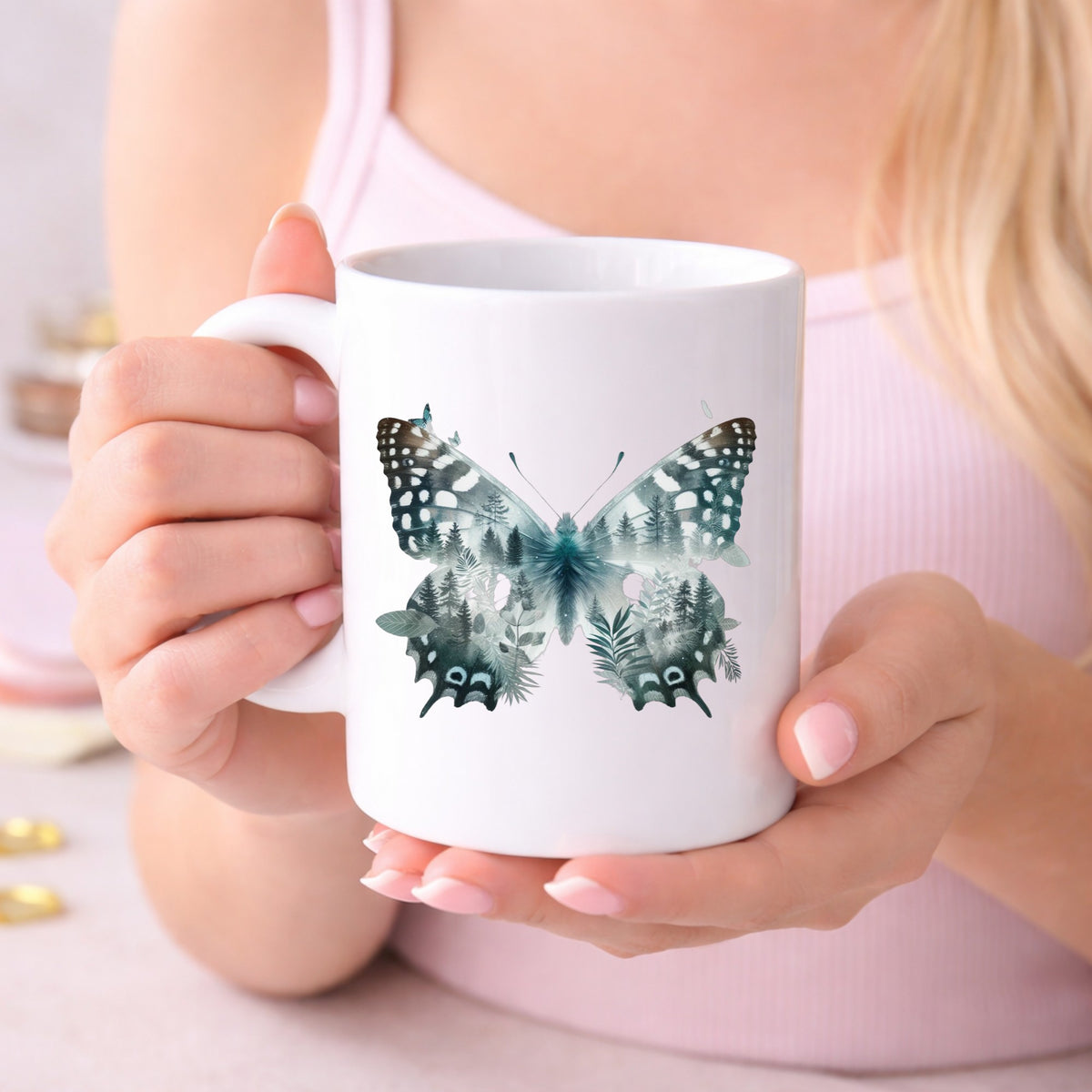 Black White Butterfly UV DTF sticker applied to a white coffee mug held in both hands