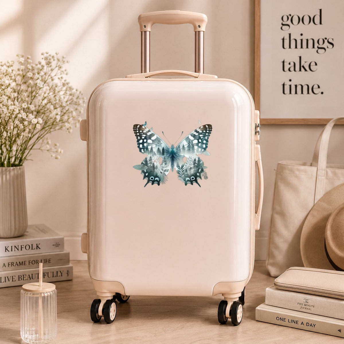 Black White Butterfly UV DTF sticker applied to a cream carry-on suitcase