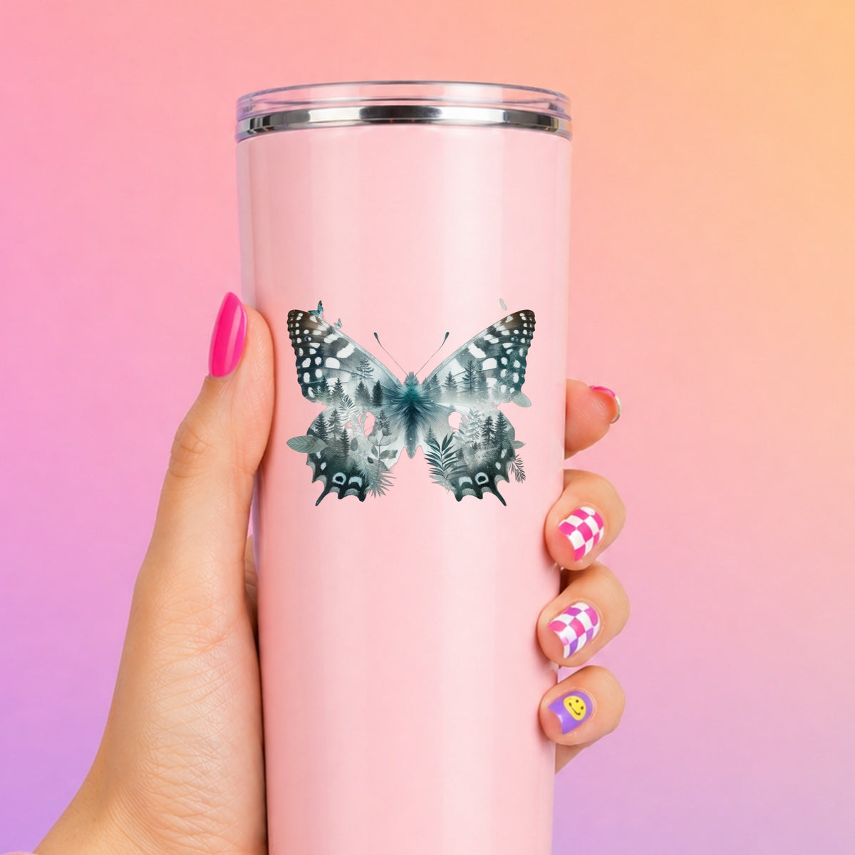 Black White Butterfly UV DTF sticker applied to a tall pink tumbler on a pink and orange background