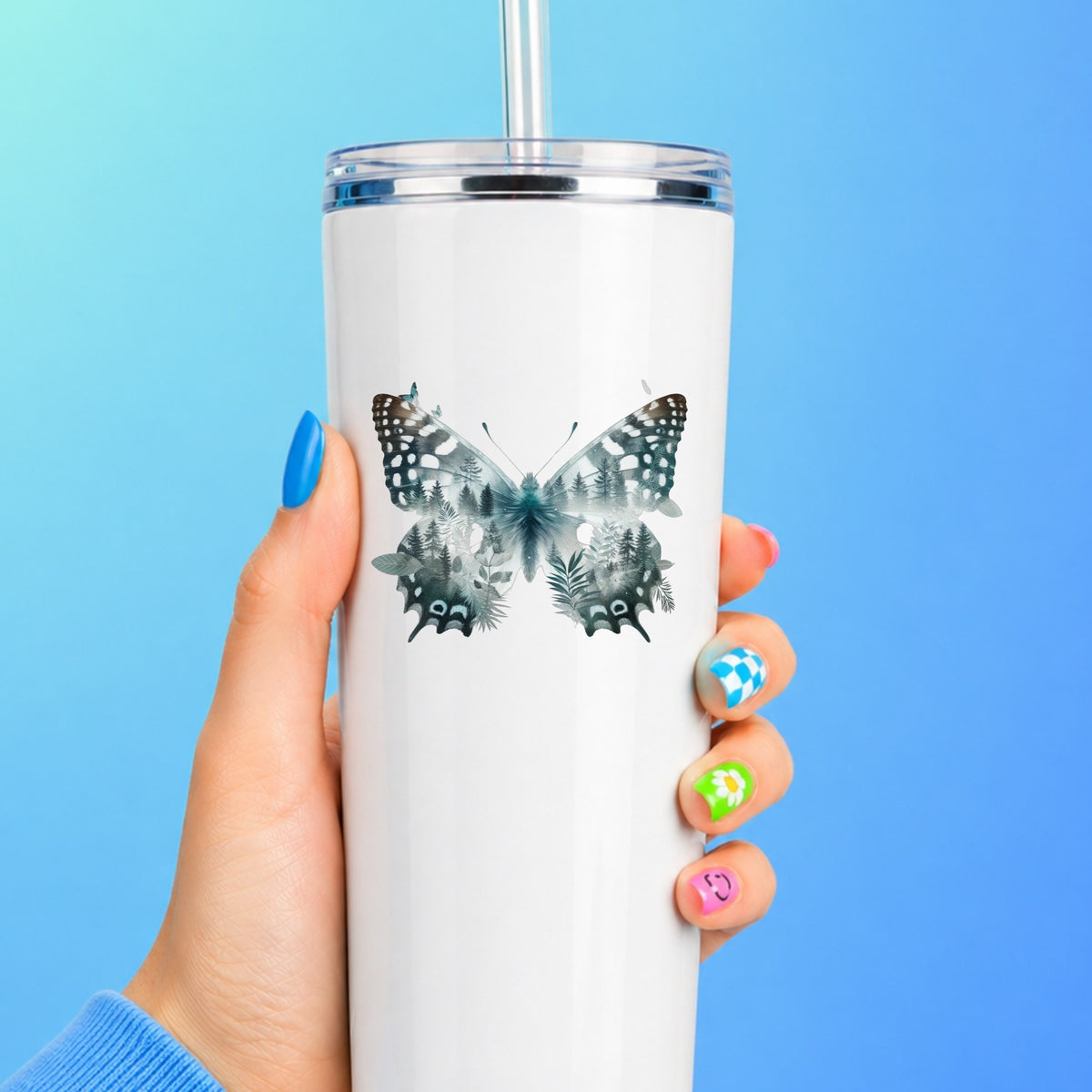 Black White Butterfly UV DTF sticker applied to a white straw tumbler on a blue background