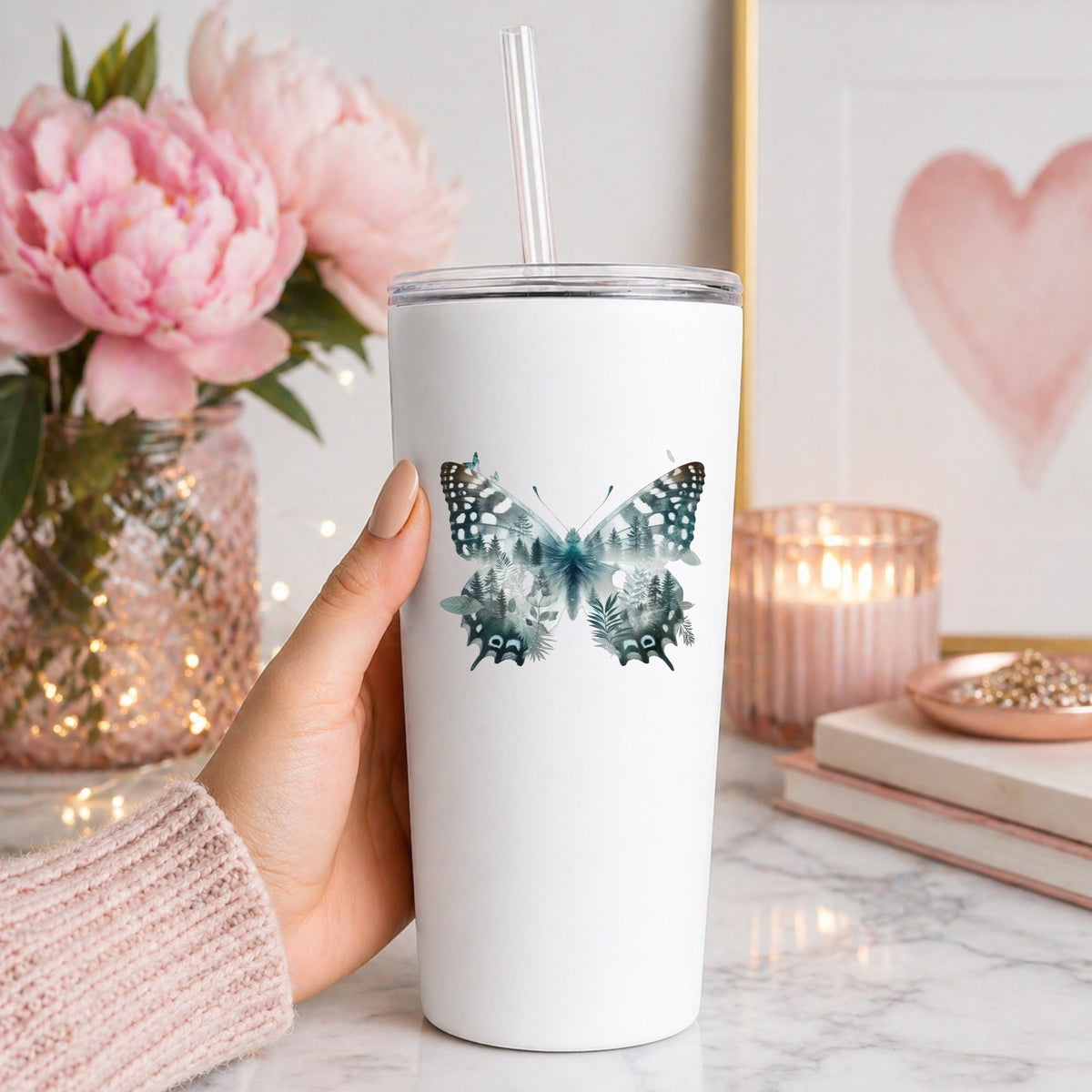 Black White Butterfly UV DTF sticker applied to a white straw tumbler beside pink peonies