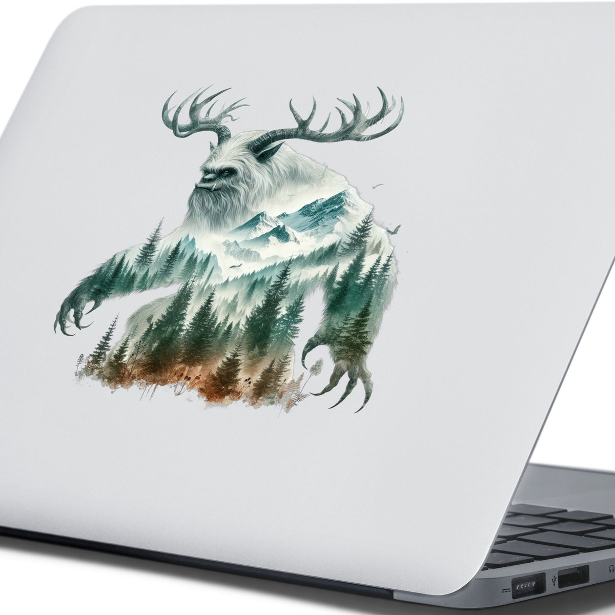 Antlered Mountain Bigfoot UV DTF sticker applied to the lid of a silver laptop