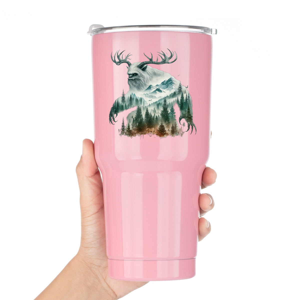 Antlered Mountain Bigfoot UV DTF sticker applied to a pink tumbler held against a white background
