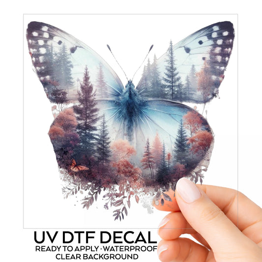 Pink Forest Butterfly UV DTF sticker on its backing card, held in hand