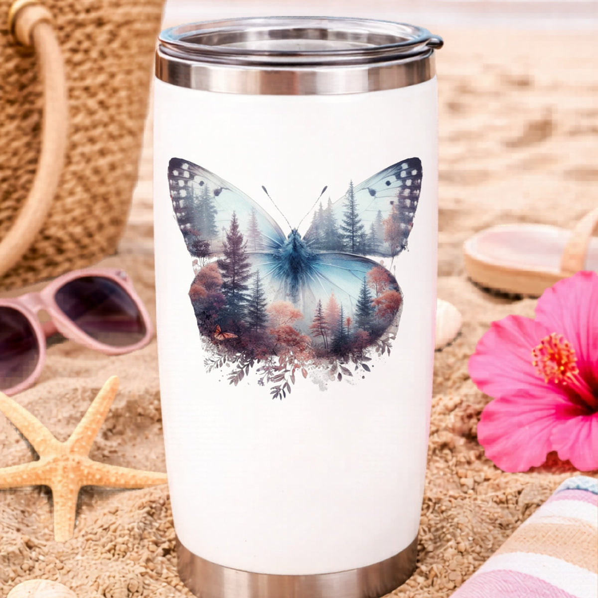Pink Forest Butterfly UV DTF sticker applied to a white travel tumbler on beach sand