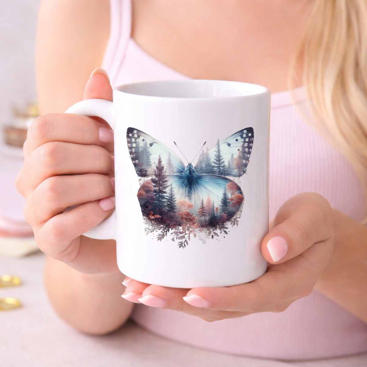 Pink Forest Butterfly UV DTF sticker applied to a white coffee mug held in both hands