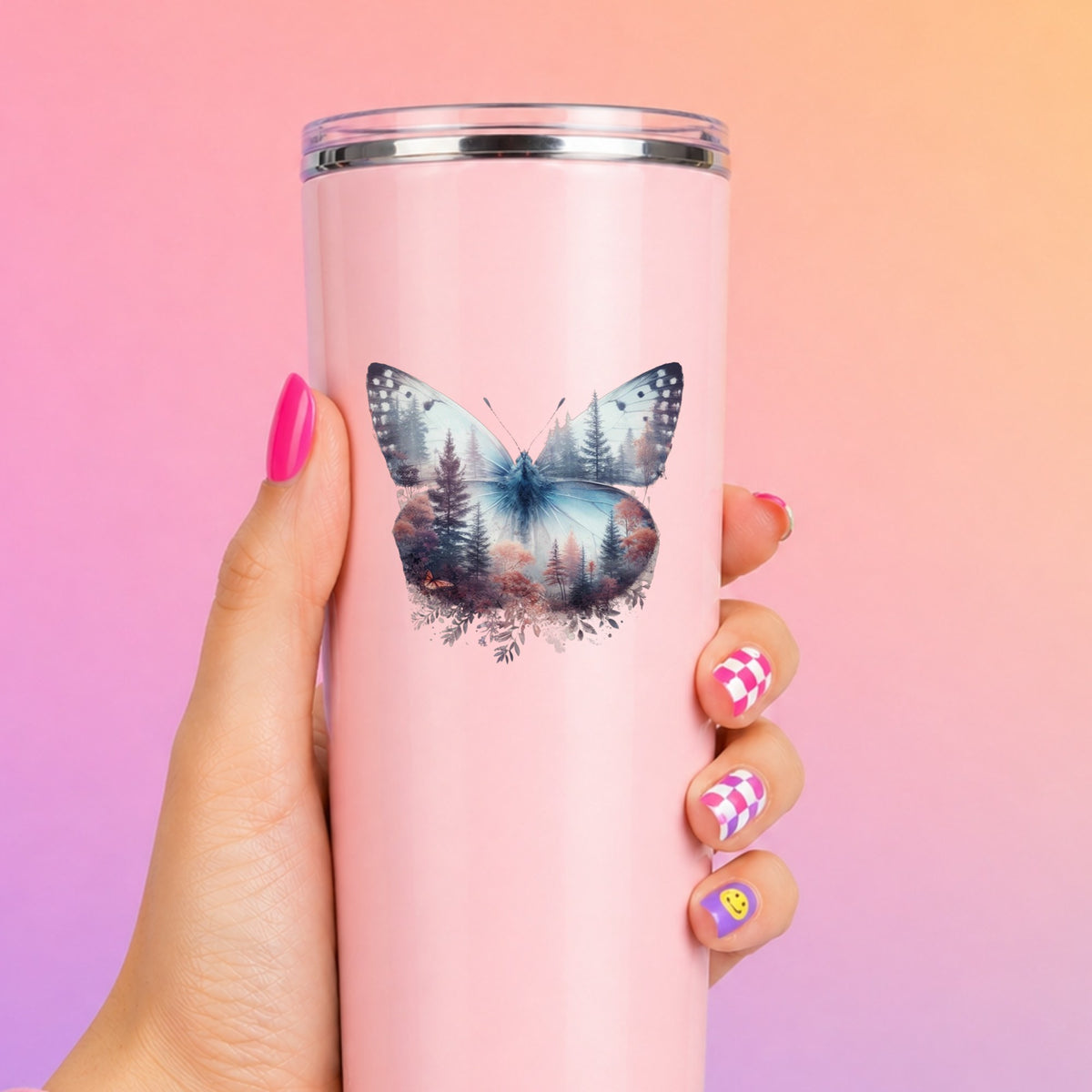 Pink Forest Butterfly UV DTF sticker applied to a tall pink tumbler on a pink and orange background