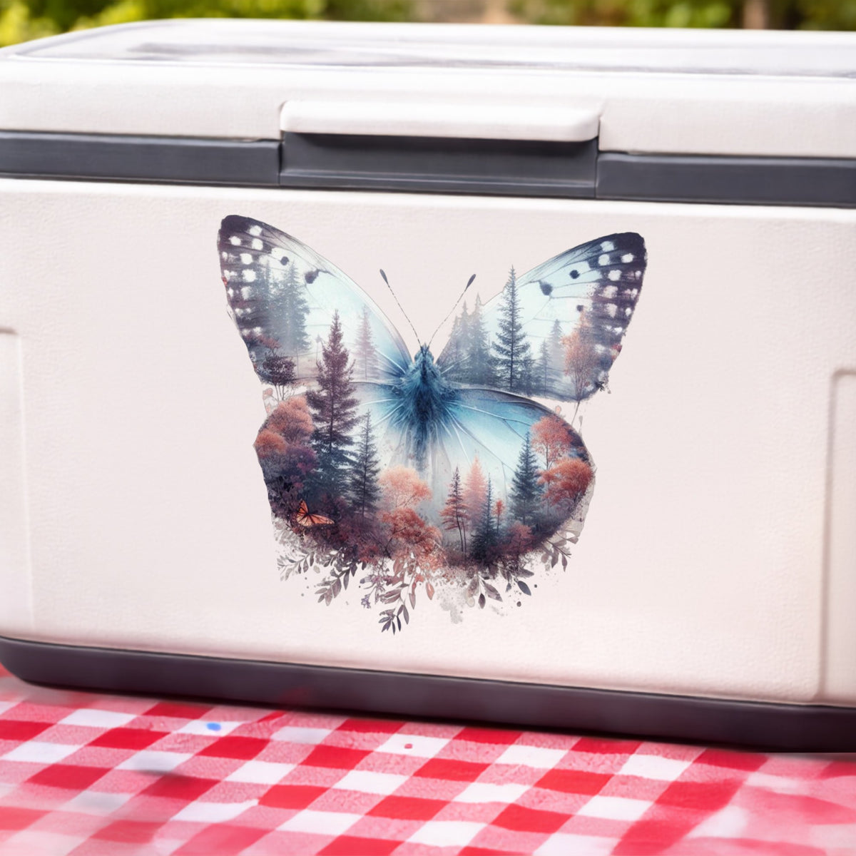 Pink Forest Butterfly UV DTF sticker applied to a white cooler on a red gingham cloth