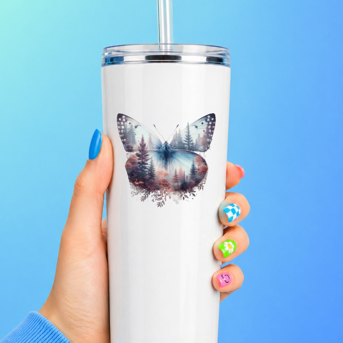 Pink Forest Butterfly UV DTF sticker applied to a white straw tumbler on a blue background