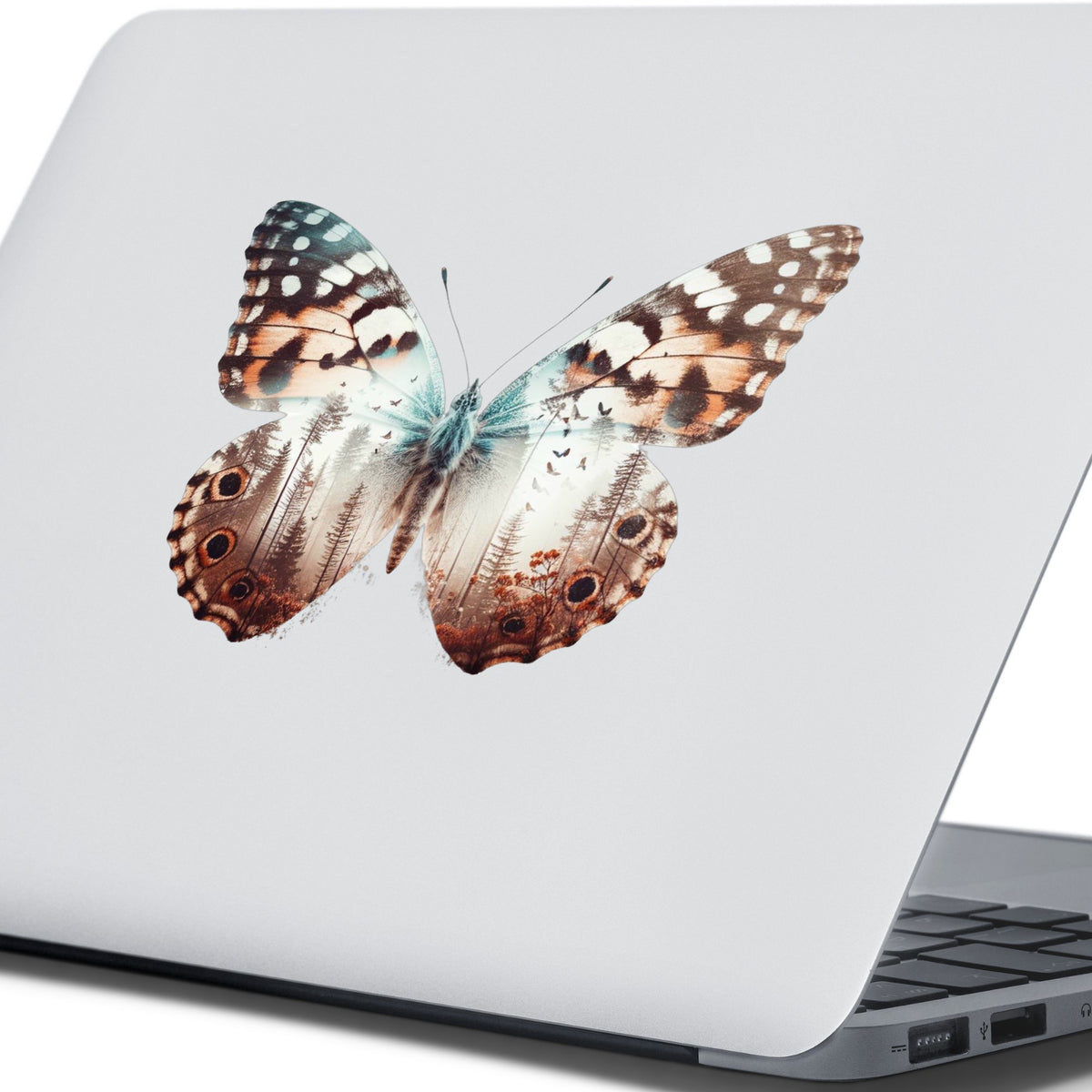 Rust Brown Butterfly UV DTF sticker applied to the lid of a silver laptop