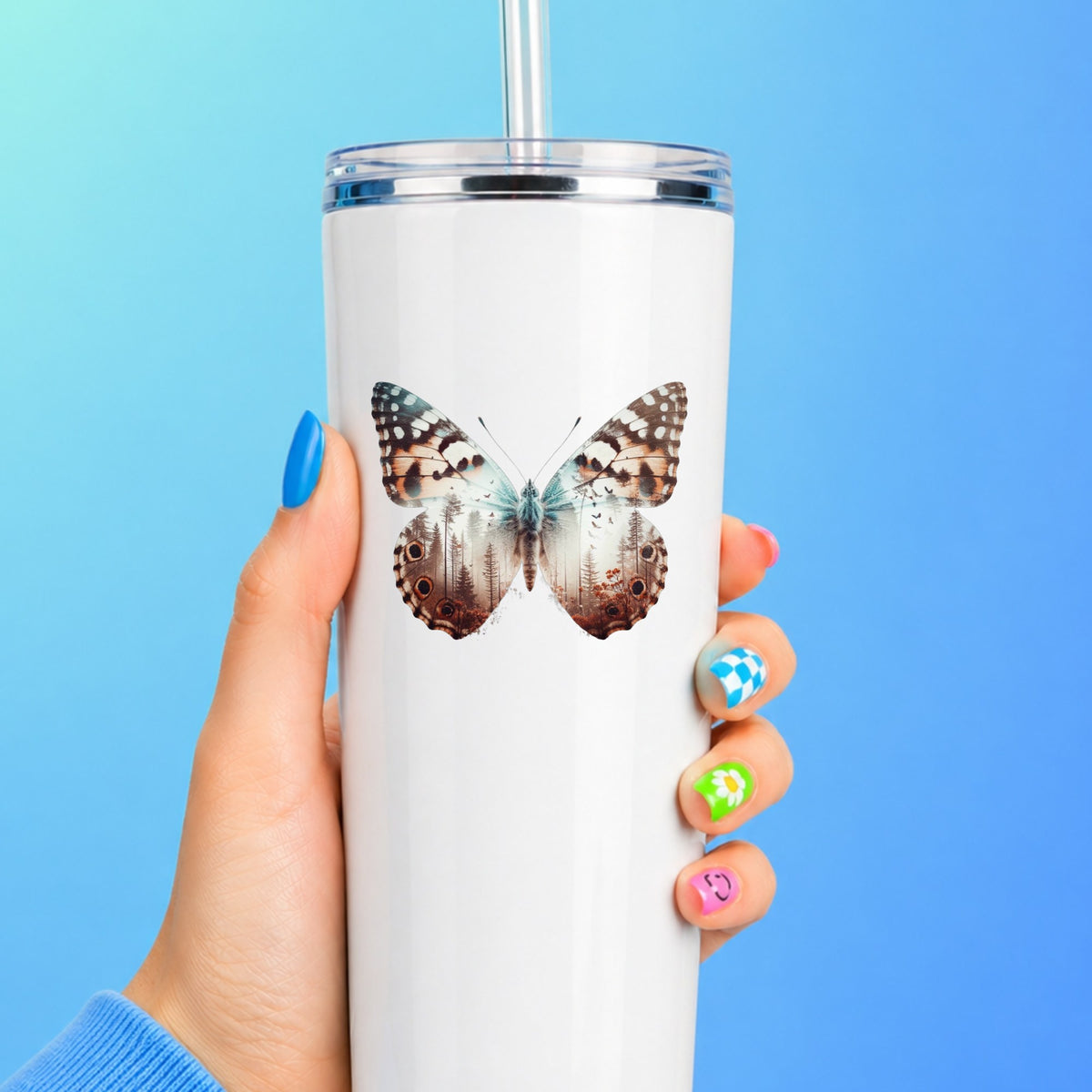 Rust Brown Butterfly UV DTF sticker applied to a white straw tumbler on a blue background