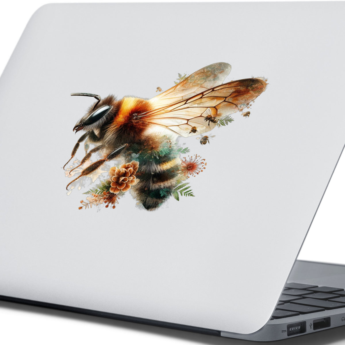 Pinecone Bumblebee UV DTF sticker applied to the lid of a silver laptop