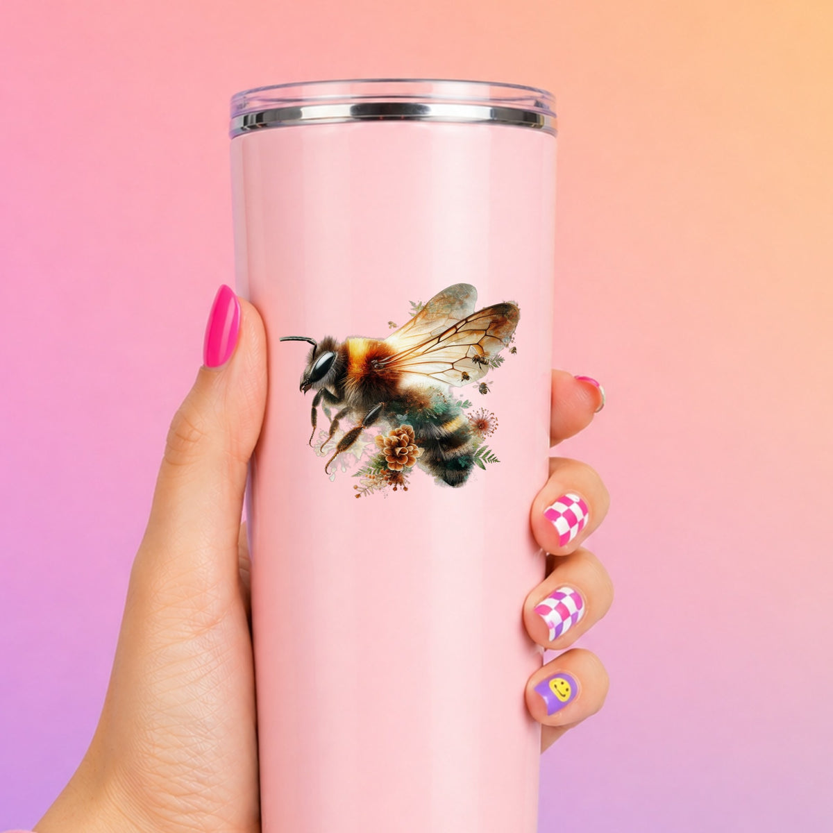 Pinecone Bumblebee UV DTF sticker applied to a tall pink tumbler on a pink and orange background