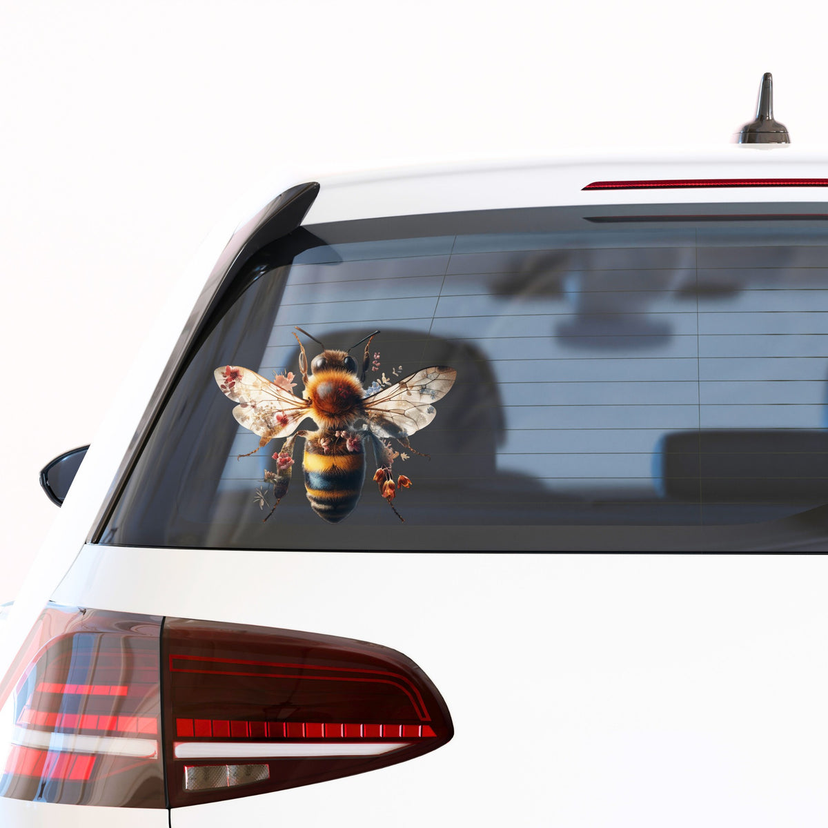 Pink Floral Bee UV DTF sticker applied to the rear window of a white car