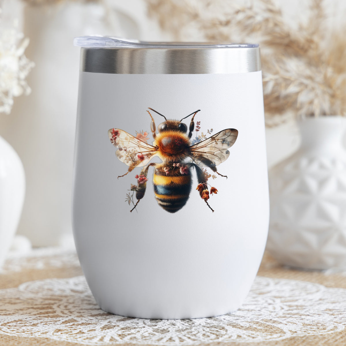 Pink Floral Bee UV DTF sticker applied to a white stemless tumbler with a lid