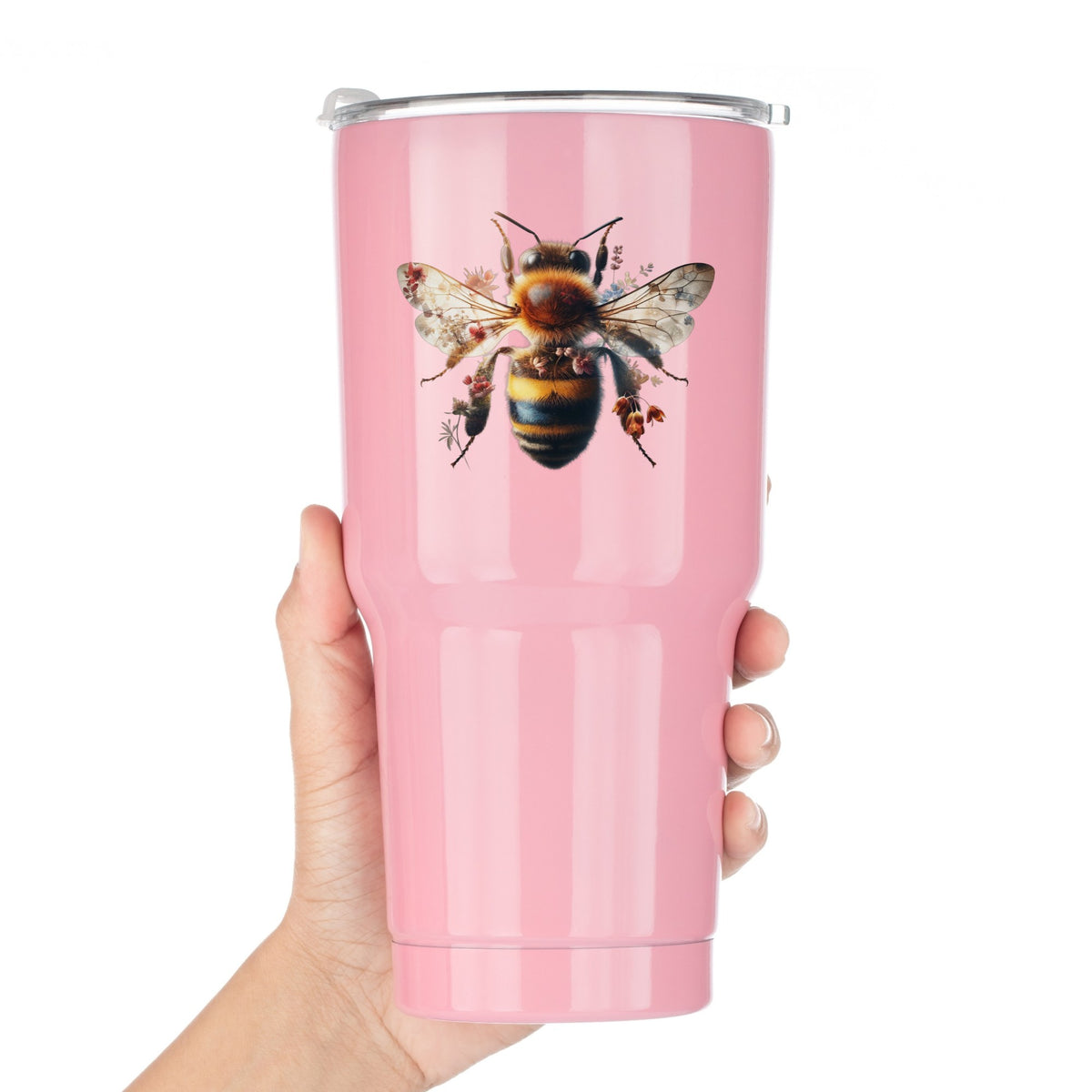 Pink Floral Bee UV DTF sticker applied to a pink tumbler held against a white background