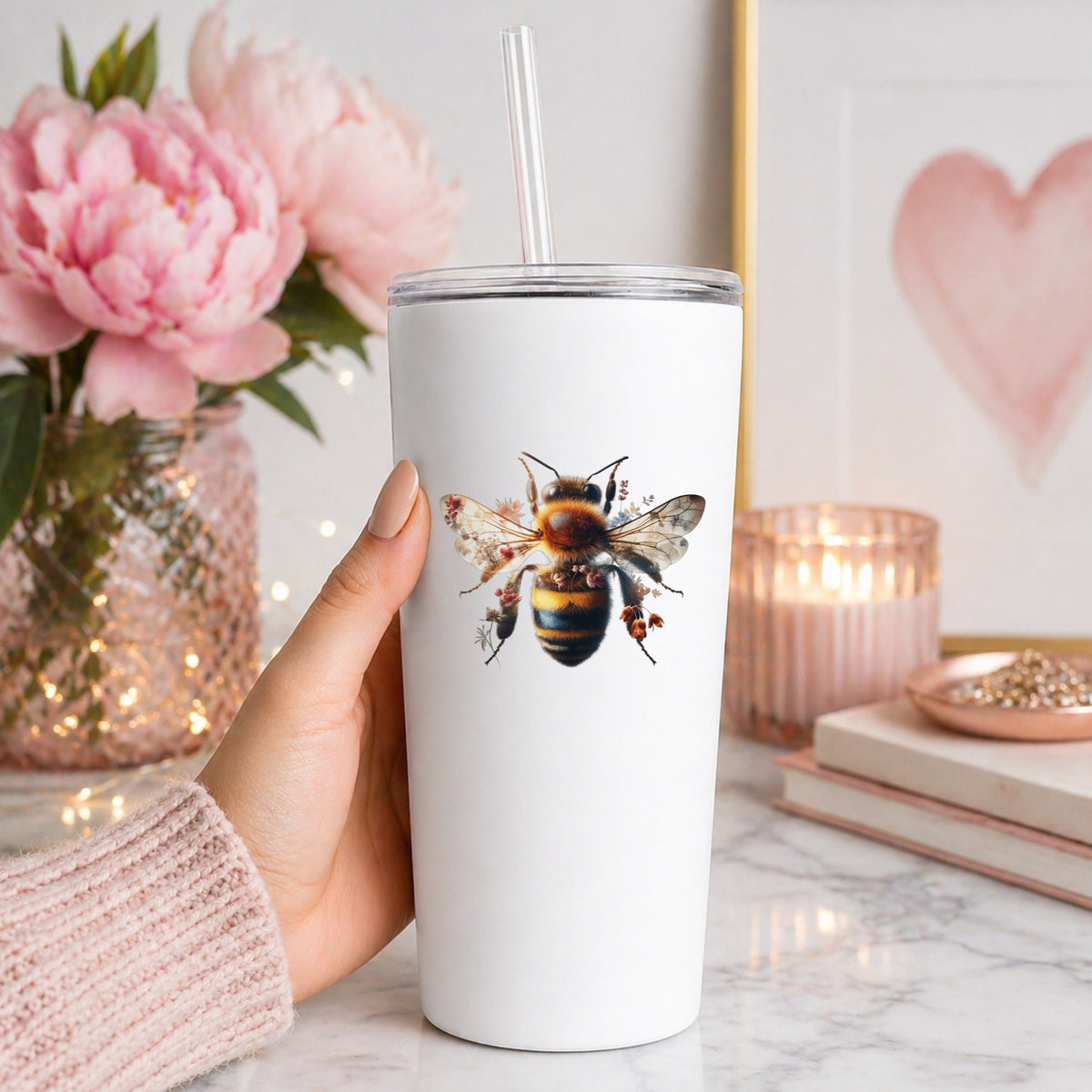 Pink Floral Bee UV DTF sticker applied to a white straw tumbler beside pink peonies
