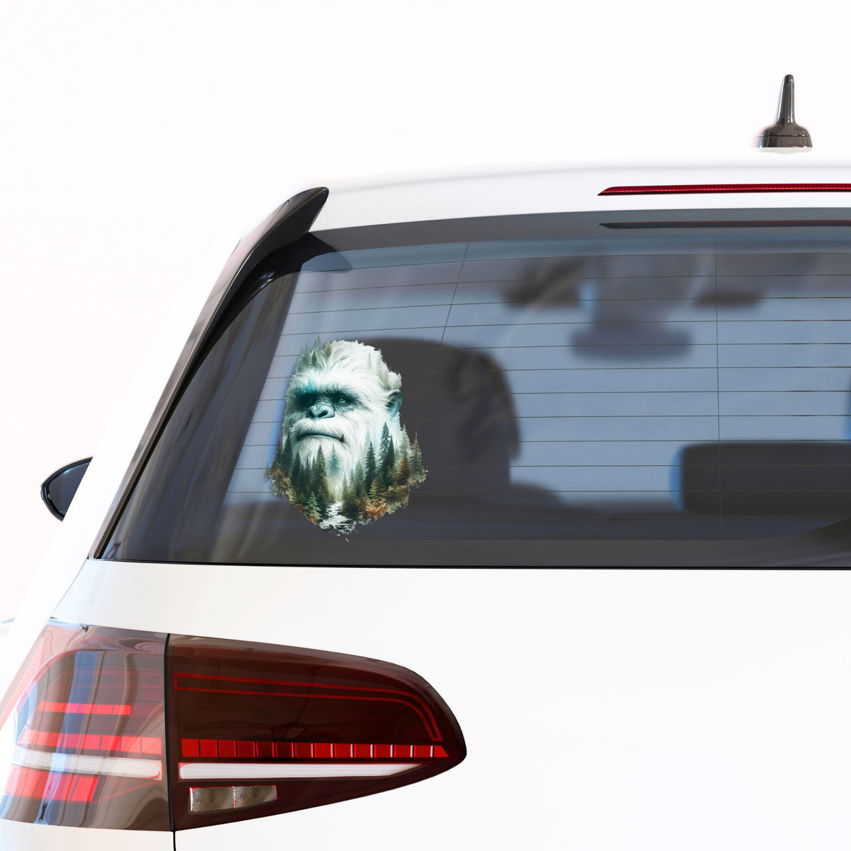 Bigfoot Face UV DTF sticker applied to the rear window of a white car